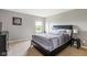 This bedroom offers a modern bed with white bedding and a tranquil atmosphere at 13234 Amundson Dr, Carmel, IN 46074