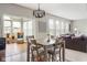 Inviting dining area with a view to a cozy sunroom and comfortable seating at 13234 Amundson Dr, Carmel, IN 46074