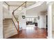 Open foyer featuring hardwood floors, staircase, and views into the living area creating a welcoming ambiance at 13234 Amundson Dr, Carmel, IN 46074