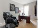This office features a massage chair, dark wood desk, and a neutral color scheme at 13234 Amundson Dr, Carmel, IN 46074
