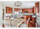 Well-equipped kitchen with stainless steel appliances, an island, and a connected dining area at 13234 Amundson Dr, Carmel, IN 46074