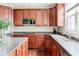 Functional kitchen featuring modern appliances, dark countertops, and ample cabinet space at 13234 Amundson Dr, Carmel, IN 46074