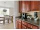 Well-organized kitchen with wooden cabinets, modern appliances, and a view of the dining area at 13234 Amundson Dr, Carmel, IN 46074