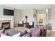 Spacious living room features a fireplace, TV, and stylish seating with an open floor plan at 13234 Amundson Dr, Carmel, IN 46074