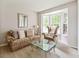 Cozy living room with patterned furnishings, bay window and neutral carpet creating a comfortable gathering space at 13234 Amundson Dr, Carmel, IN 46074