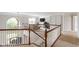 Upstairs loft area with staircase, chandelier and view of the living room at 13234 Amundson Dr, Carmel, IN 46074