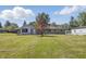 Home with a large backyard, mature trees, and detached garage at 1328 Toner Dr, Anderson, IN 46012