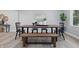 Dining area with modern wood table, bench, and chairs, perfect for Gathering gatherings at 1328 Toner Dr, Anderson, IN 46012