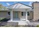Inviting front porch with stylish pillars and a freshly painted door, enhancing curb appeal at 1328 Toner Dr, Anderson, IN 46012