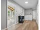 Functional laundry room featuring a utility sink, washer, dryer, and sunroom access at 1328 Toner Dr, Anderson, IN 46012