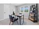 Comfortable home office with built-in shelves, a desk, and modern decor at 1328 Toner Dr, Anderson, IN 46012