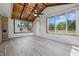 Bright sunroom featuring a wood-paneled ceiling and large windows at 1328 Toner Dr, Anderson, IN 46012