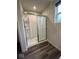 Bathroom featuring a walk-in shower with glass doors and a convenient built-in shelf at 13460 Dewpoint Ln, Fishers, IN 46037