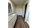 Bathroom with granite countertop, wood-look flooring, and shower at 13460 Dewpoint Ln, Fishers, IN 46037