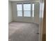 Bedroom featuring gray carpet and three windows for ample natural light at 13460 Dewpoint Ln, Fishers, IN 46037