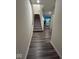 Hallway leads to staircase with carpeted steps and vinyl floors at 13460 Dewpoint Ln, Fishers, IN 46037