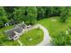 Aerial view of this beautiful home showing the winding driveway and verdant yard at 1409 S Northview Dr, Martinsville, IN 46151