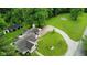 Charming home with lush lawn, American flag, outbuildings and long, winding driveway at 1409 S Northview Dr, Martinsville, IN 46151