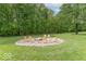 Outdoor area with firepit and chairs in a secluded yard at 1409 S Northview Dr, Martinsville, IN 46151
