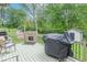 This deck offers a grill, stone fireplace and dining seating, perfect for outdoor entertaining at 1409 S Northview Dr, Martinsville, IN 46151