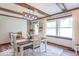 Cozy dining room with wood beams and abundant natural light at 1409 S Northview Dr, Martinsville, IN 46151