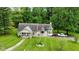 Charming home with well-manicured lawn, American flag, and mature trees at 1409 S Northview Dr, Martinsville, IN 46151