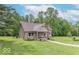 Beautiful single-Gathering home with well-manicured lawn, front porch, and unique architectural details at 1409 S Northview Dr, Martinsville, IN 46151