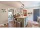 Charming kitchen island with chairs, stainless steel appliances, and neutral design at 1409 S Northview Dr, Martinsville, IN 46151