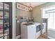 Well-equipped laundry room featuring washer, dryer, and storage at 1409 S Northview Dr, Martinsville, IN 46151