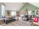 Inviting living area with plush sofas, patterned rug, and a view of the backyard at 1409 S Northview Dr, Martinsville, IN 46151