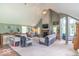 Spacious living room boasts vaulted ceilings, lots of natural light, and a charming fireplace at 1409 S Northview Dr, Martinsville, IN 46151