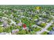 Expansive aerial view of a neighborhood with lush greenery, well-maintained homes, and mature trees at 14215 Stacey St, Carmel, IN 46033
