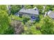 Overhead view of home on green lawn with outdoor patio, green landscaping, and retaining wall at 14215 Stacey St, Carmel, IN 46033