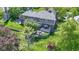 Aerial view of backyard with beautiful landscaping, an outdoor patio, and a retaining wall at 14215 Stacey St, Carmel, IN 46033