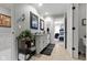 Well-lit bathroom featuring double vanity, granite countertops, and view into an adjacent bedroom at 14215 Stacey St, Carmel, IN 46033