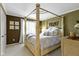 Serene bedroom with a four-poster bed, soft lighting, and neutral colors for a peaceful retreat at 14215 Stacey St, Carmel, IN 46033