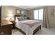 Cozy bedroom featuring a comfortable bed, neutral decor, and a window with natural light at 14215 Stacey St, Carmel, IN 46033