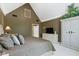 Relaxing bedroom with TV, plants, high ceilings, and cozy neutral color palette at 14215 Stacey St, Carmel, IN 46033