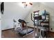 Bright exercise room equipped with treadmill, elliptical, and stationary bike for a complete workout at 14215 Stacey St, Carmel, IN 46033