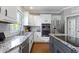 Kitchen with stainless steel appliances and granite countertops, offering sleek design at 14215 Stacey St, Carmel, IN 46033