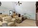Relaxing living room with comfortable seating, a ceiling fan, and plenty of space for entertaining guests at 14215 Stacey St, Carmel, IN 46033