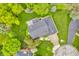 Aerial view of a house featuring a large backyard, mature trees, and driveway, situated on a well-maintained property at 14809 Senator Way, Carmel, IN 46032