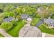 Beautiful two-story home with a well-manicured front lawn, mature trees, and a long driveway in a lush neighborhood at 14809 Senator Way, Carmel, IN 46032