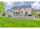 Lush backyard with a deck, ample seating, and a well-maintained lawn perfect for outdoor activities at 14809 Senator Way, Carmel, IN 46032