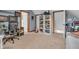 Spacious carpeted bedroom with white shelving, desk, and doorway to other rooms at 14809 Senator Way, Carmel, IN 46032