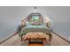 Charming bedroom features dormer window, soothing color scheme, and bench at the foot of the bed at 14809 Senator Way, Carmel, IN 46032