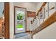 Entryway with wood staircase and view to the backyard at 14809 Senator Way, Carmel, IN 46032