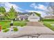 Inviting two-story home showcasing a well-maintained lawn and a spacious driveway leading to an attached garage at 14809 Senator Way, Carmel, IN 46032