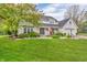 Inviting two-story home with a well-maintained lawn and manicured landscaping at 14809 Senator Way, Carmel, IN 46032