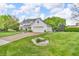 Beautiful home with lush lawn, manicured landscaping, and an inviting driveway leading to a two-car garage at 14809 Senator Way, Carmel, IN 46032